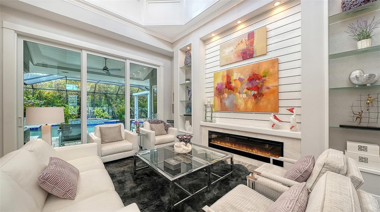 Imagine sitting here at night with the fireplace flickering, listening to the sound of the waterfall into the pool - 1794 CUNLIFF LN, SARASOTA