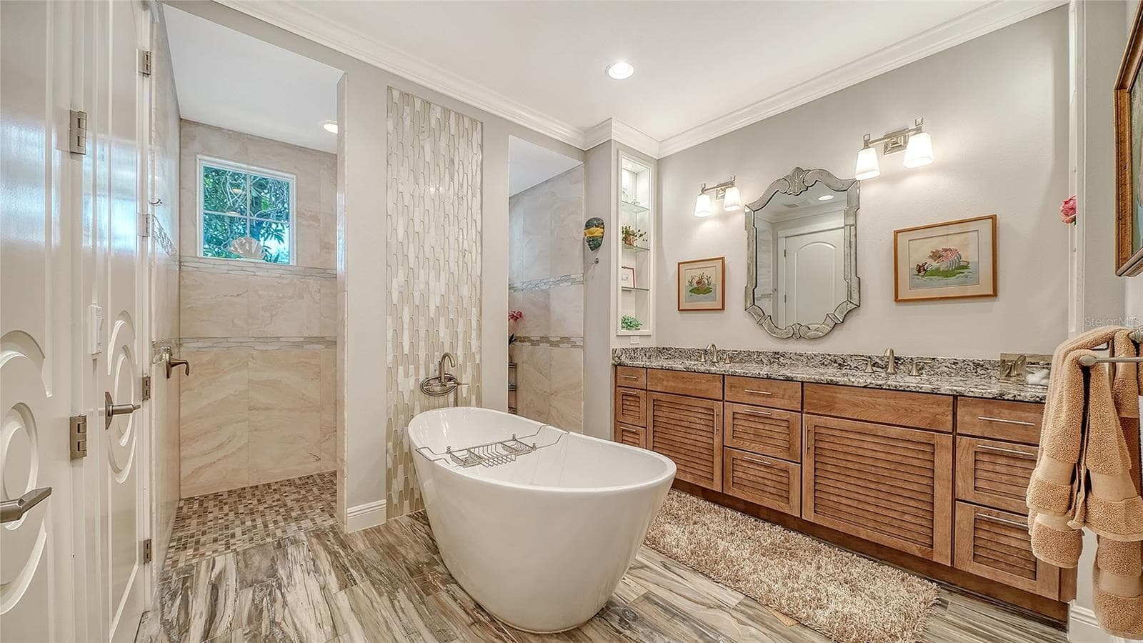 The ensuite bath delights with a soaking tub, walk-though shower, and dual sinks - 1794 CUNLIFF LN, SARASOTA
