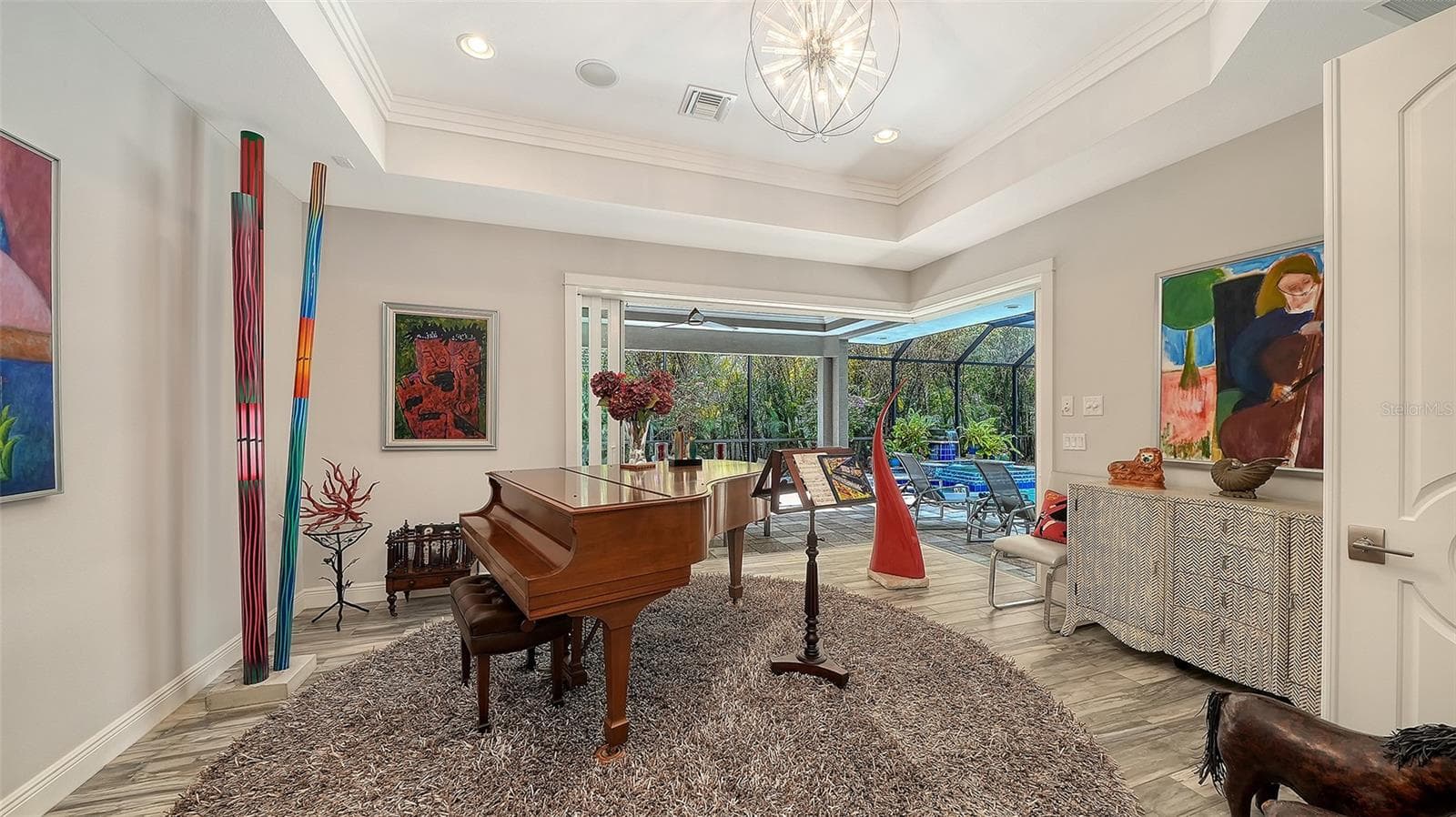The bonus room can be anything you want! A media room, a kid's play area, a man-cave, a hobby room. Or in this case, a music room! - 1794 CUNLIFF LN, SARASOTA