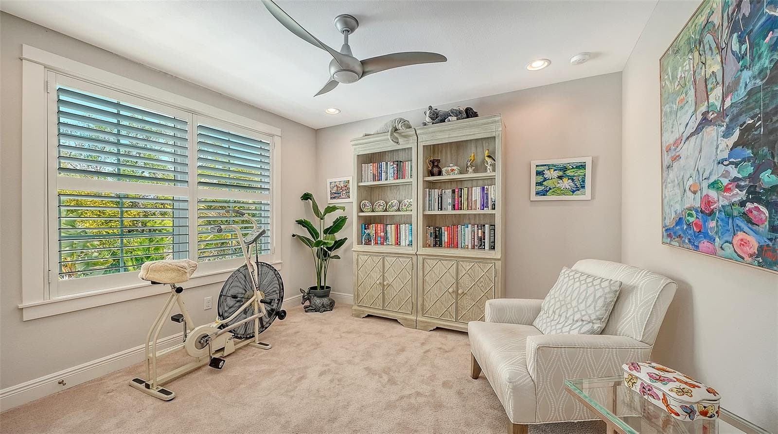 Bedroom three is at the top of the stairs. It is carpeted and sheltered with Bahama shutters - 1794 CUNLIFF LN, SARASOTA