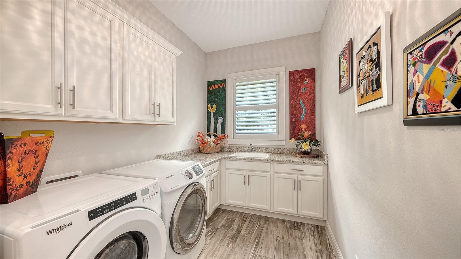 The laundry room is downstairs, just off the foyer - 1794 CUNLIFF LN, SARASOTA