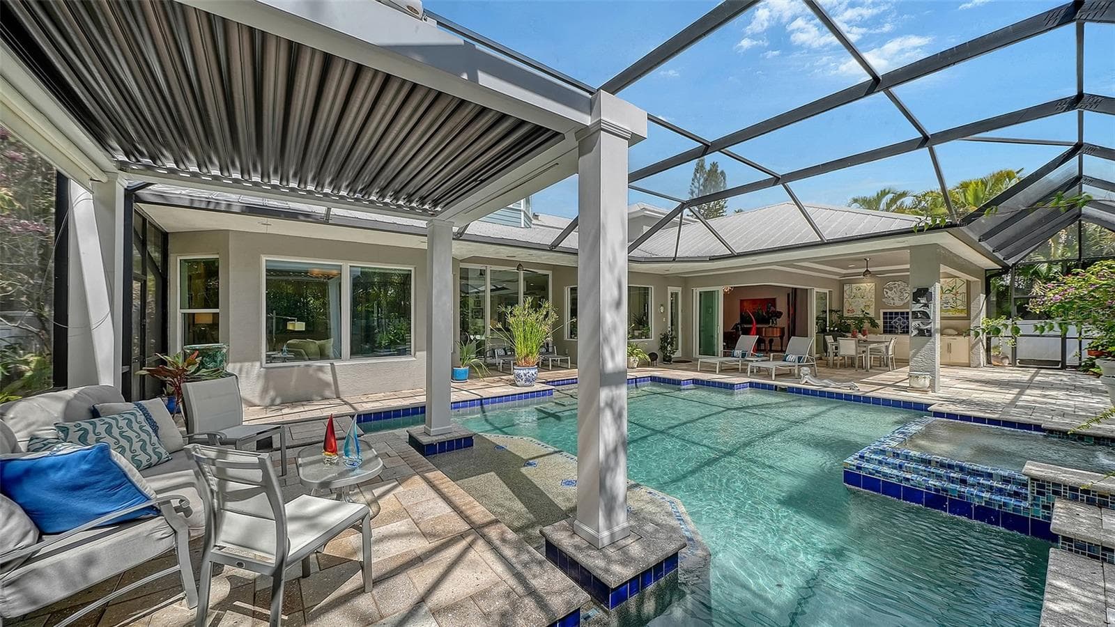 The roof of the pergula can be opened or closed, for additional sun or shade. It also features a water wall, (not shown) cascading into the pool - 1794 CUNLIFF LN, SARASOTA