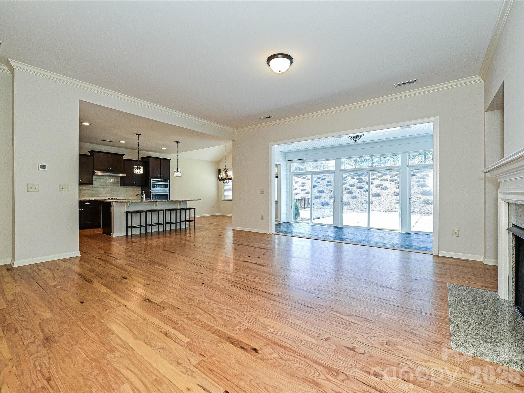 Greatroom w gas fireplace; open to kitchen and sunroom - 2004 Rockbrook Lane, Belmont