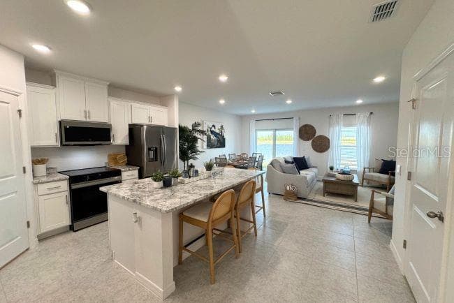 Model home - actual features may vary. - 10721 FOUNTAIN PALM CIR, BOKEELIA