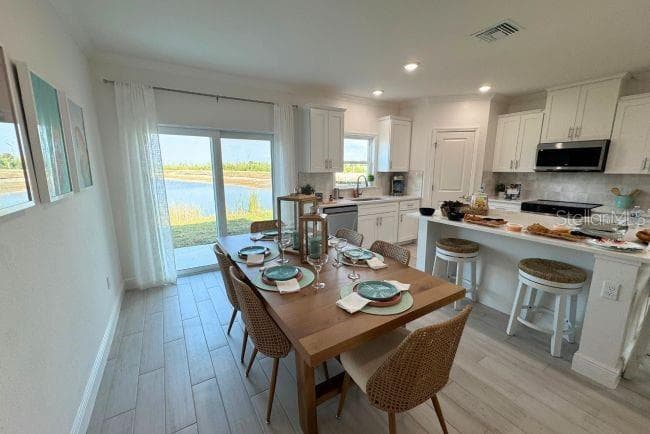 Model home - actual features may vary. - 10721 FOUNTAIN PALM CIR, BOKEELIA