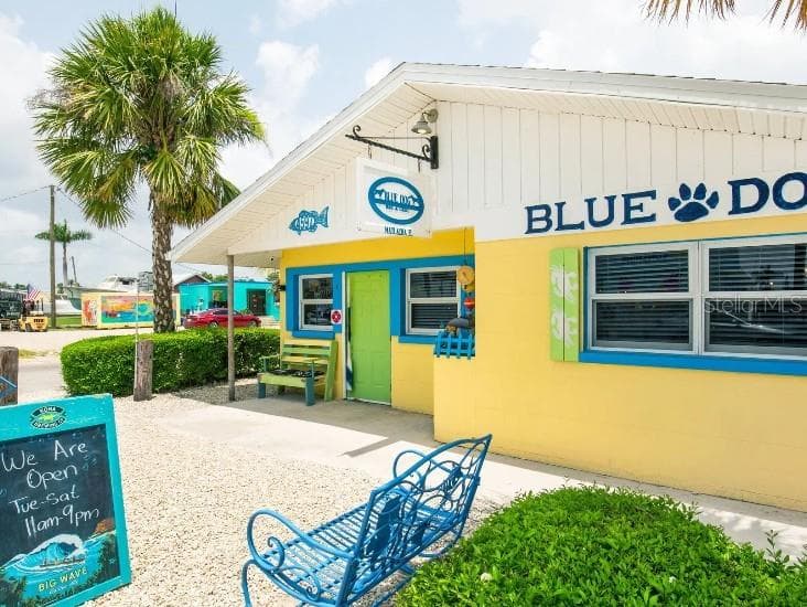 Fresh seafood, island vibes, & waterfront views at Blue Dog - 10721 FOUNTAIN PALM CIR, BOKEELIA