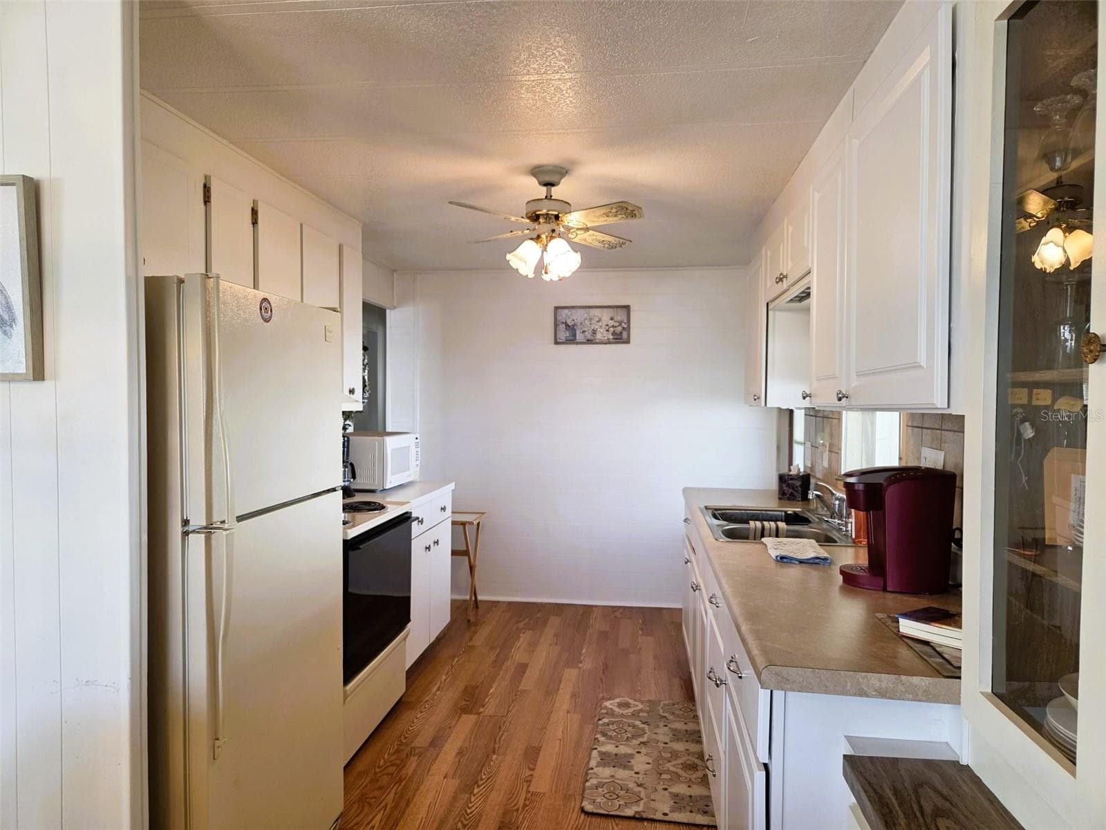 Kitchen view from dining room - 3312 OVERCUP OAK TER, SARASOTA