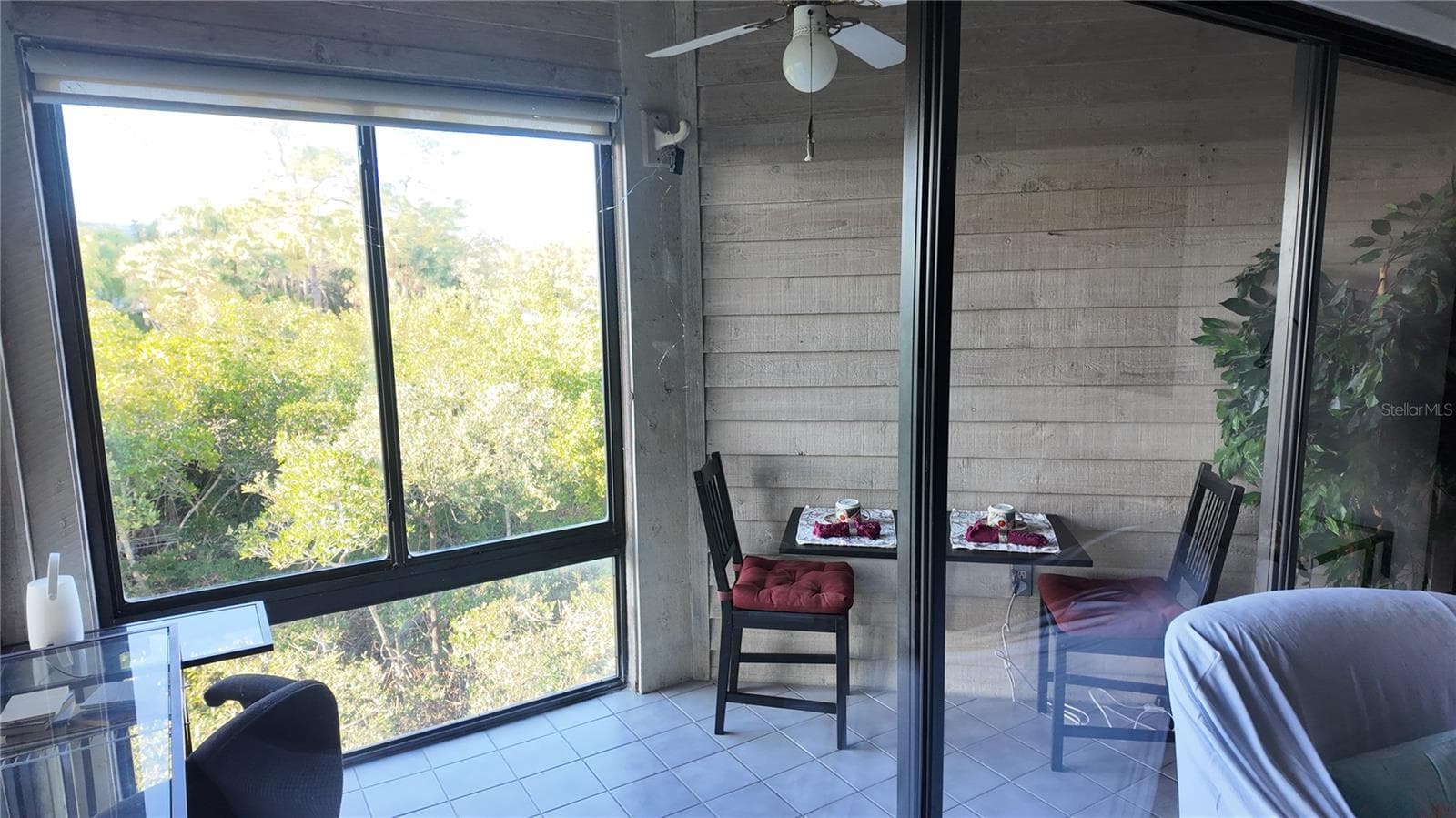 Lanai can be opened to central AC/Heat and has views of the mangroves, Gulf of Mexico and Sunset Beach.... Howard Beach in the background. - 1500 SUNSET RD BLDG C #C7, TARPON SPRINGS