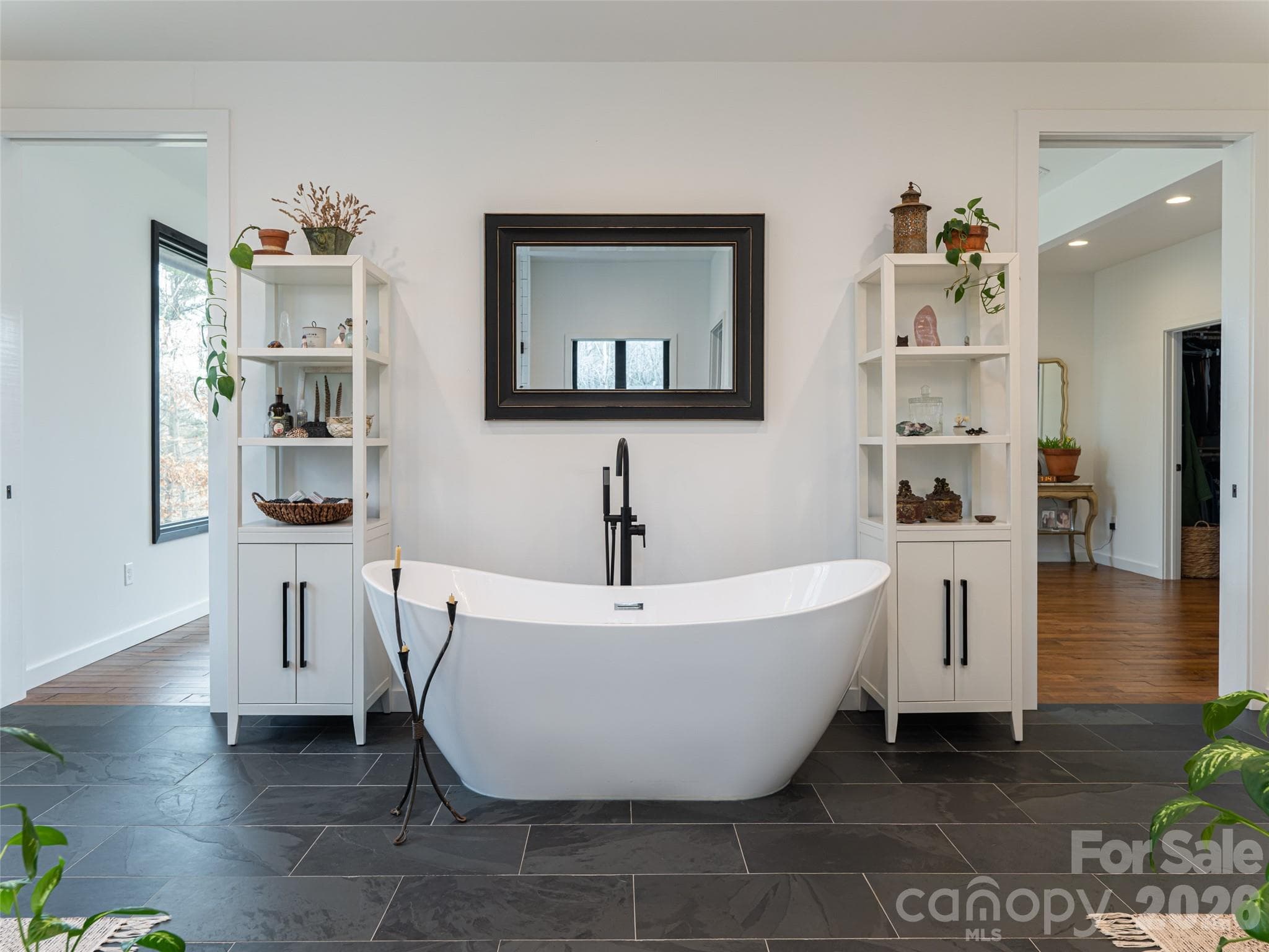 Primary Bathroom has stunning Brazilian slate floors and a soaking tub - 508 Avery Creek Road, Arden