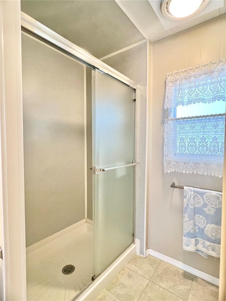Primary bathroom with walk in shower - 1100 BELCHER RD S #197, LARGO