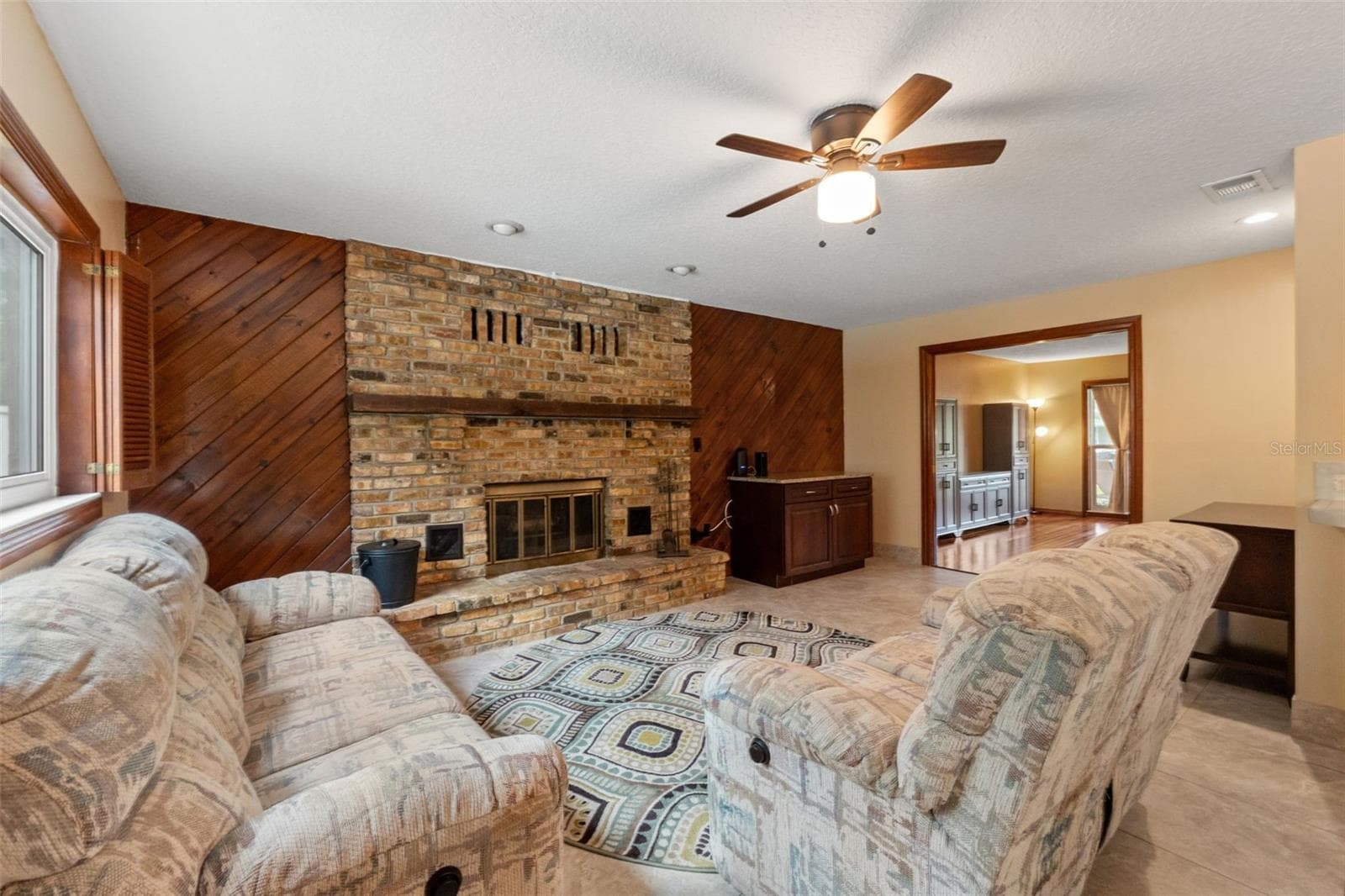 primary family room with wood burning fireplace - 1357 DINSMORE CT, NEW PORT RICHEY