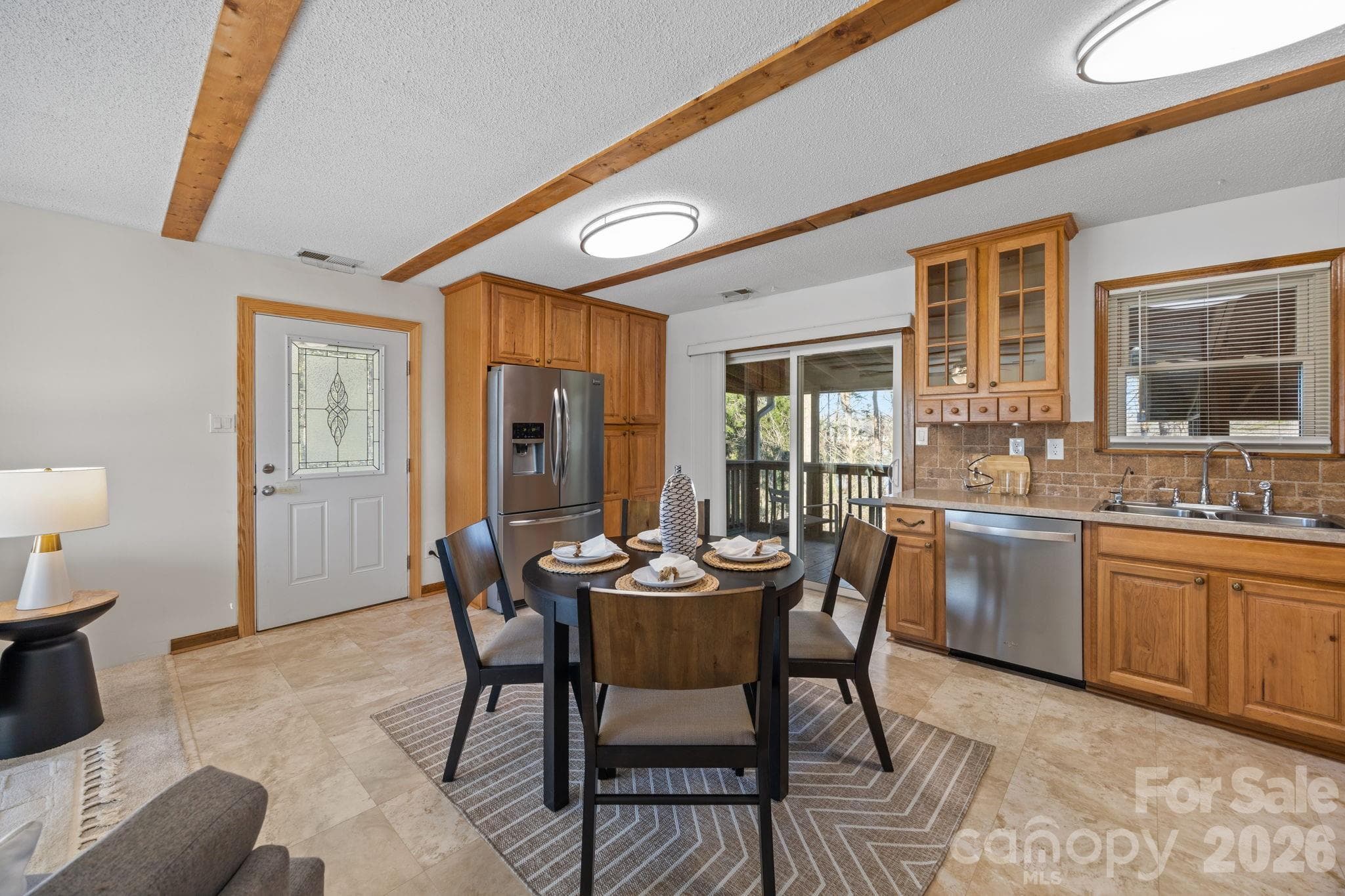 View of kitchen and dining area leading out to two screened in porches! - 4278 Harbor Lane, Sherrills Ford