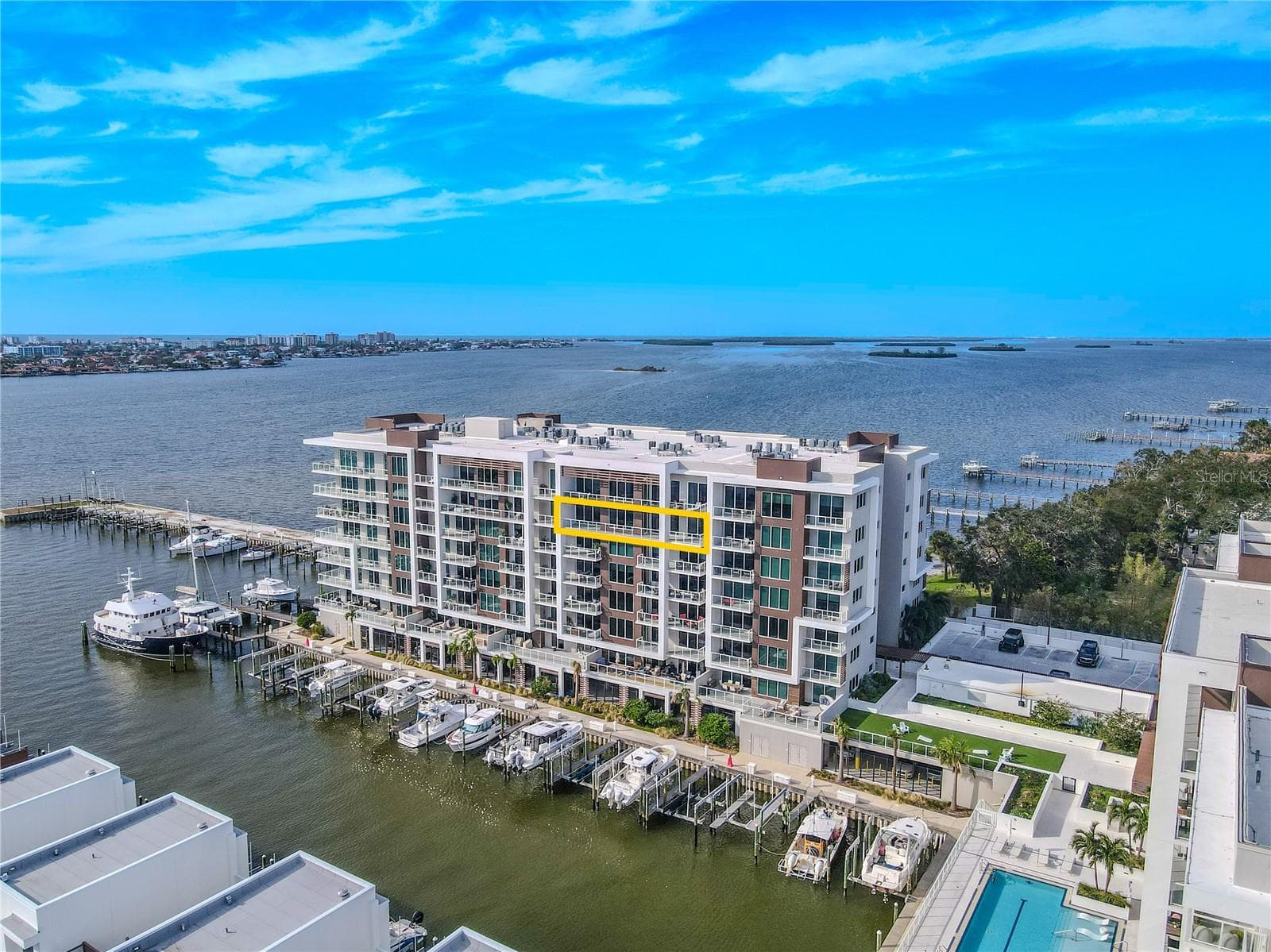 Perched on the 7th floor of Marina Bay 880, this 3-bedroom, 4-bath luxury penthouse-style residence showcases stunning panoramic views of the Intracoastal Waterway and marina below. Designed for refined coastal living, the residence includes two assigned parking spaces (#88 and #45) within a secure garage for added convenience. - 920 N OSCEOLA AVE #703, CLEARWATER