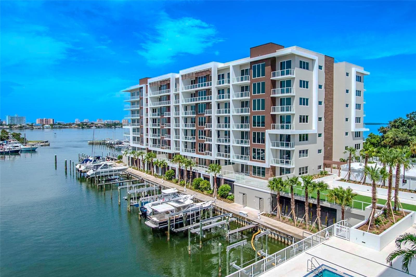 Marina Bay 880 offers breathtaking waterfront views, showcased through expansive floor-to-ceiling windows and sleek glass railings that ensure an uninterrupted connection to the sparkling Intracoastal below. Spacious terraces invite seamless indoor-outdoor living, allowing you to soak in the beauty of the marina, passing yachts, and vivid coastal skyline from every angle. - 920 N OSCEOLA AVE #703, CLEARWATER