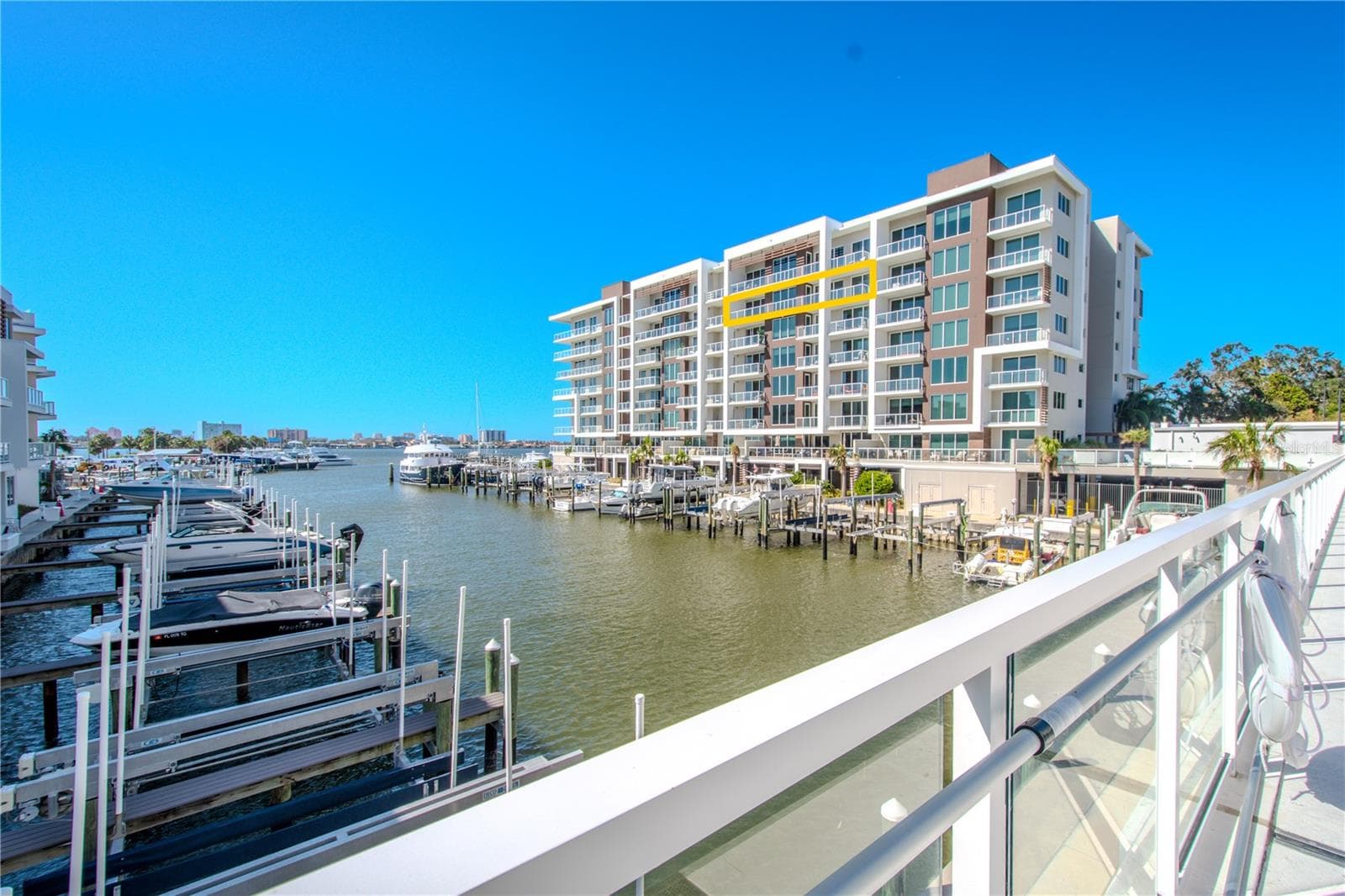 Marina Bay 880 offers breathtaking waterfront views, showcased through expansive floor-to-ceiling windows and sleek glass railings that ensure an uninterrupted connection to the sparkling Intracoastal below. Spacious terraces invite seamless indoor-outdoor living, allowing you to soak in the beauty of the marina, passing yachts, and vivid coastal skyline from every angle. - 920 N OSCEOLA AVE #703, CLEARWATER