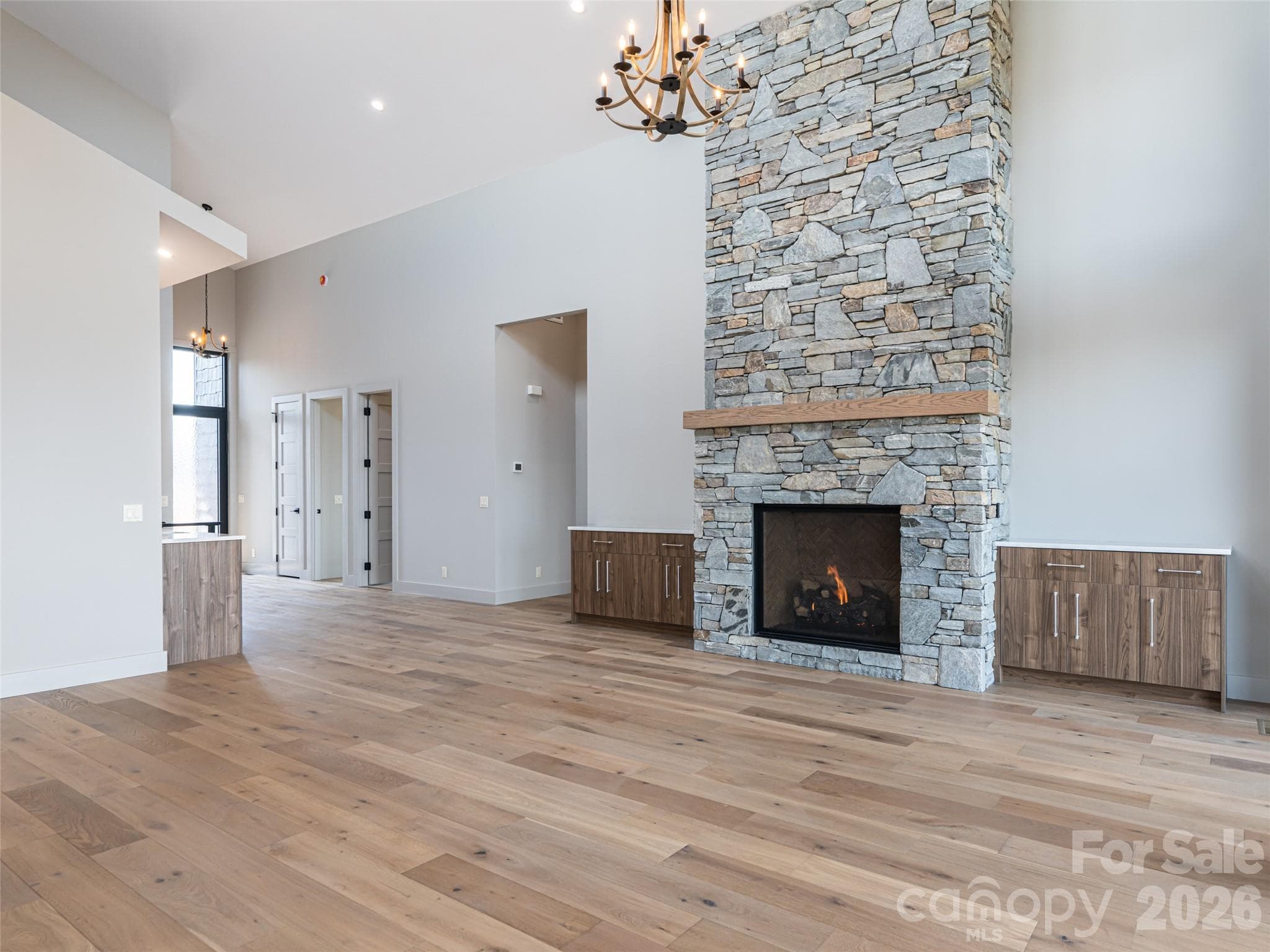 Family Room with Floor to Ceiling Stacked Stone Natural Gas Fireplace - 247 Coachman Drive, Hendersonville