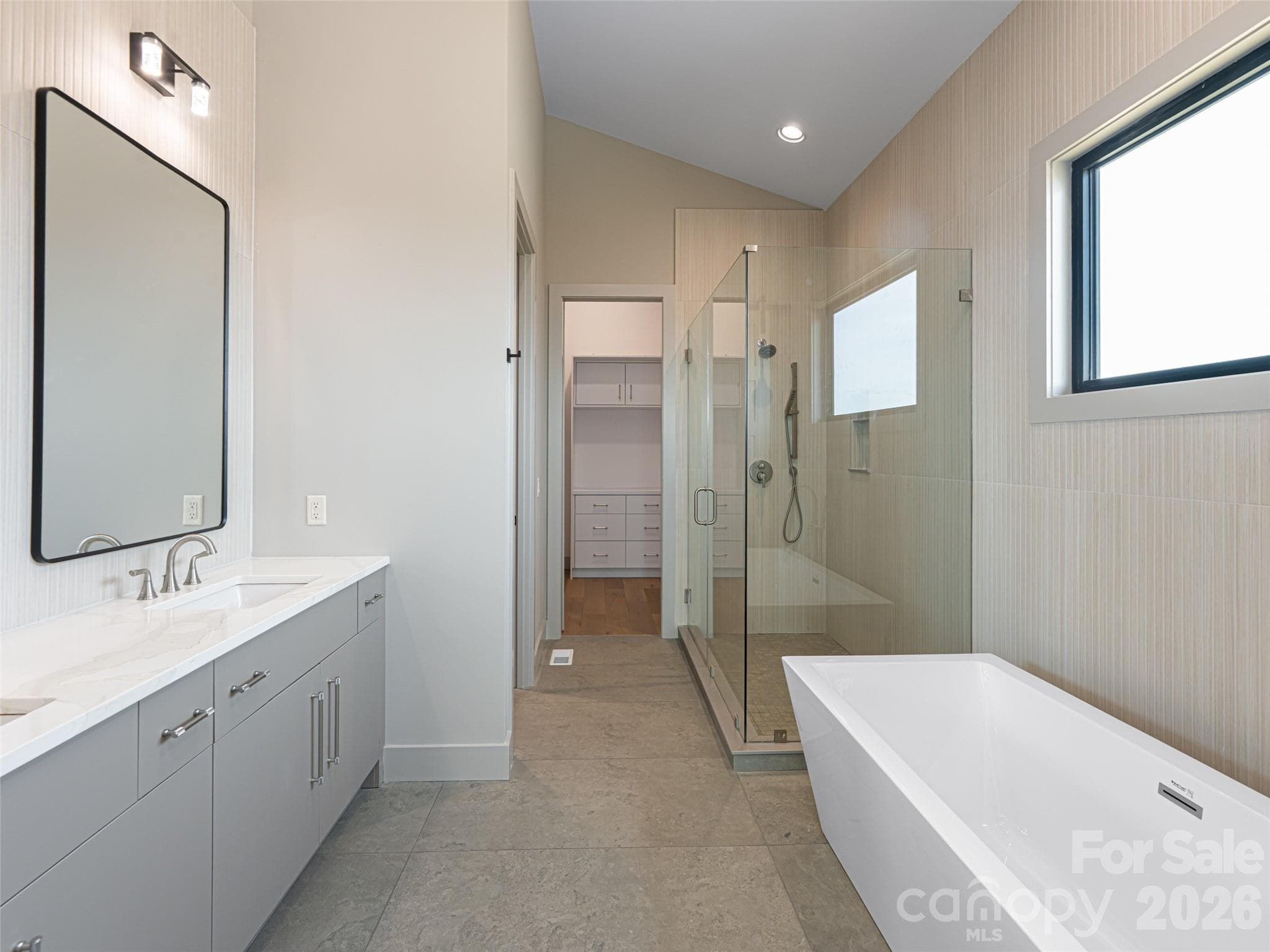 Primary Bathroom with Walk In Closet and Step-in Tile Shower & Soaker Tub - 247 Coachman Drive, Hendersonville
