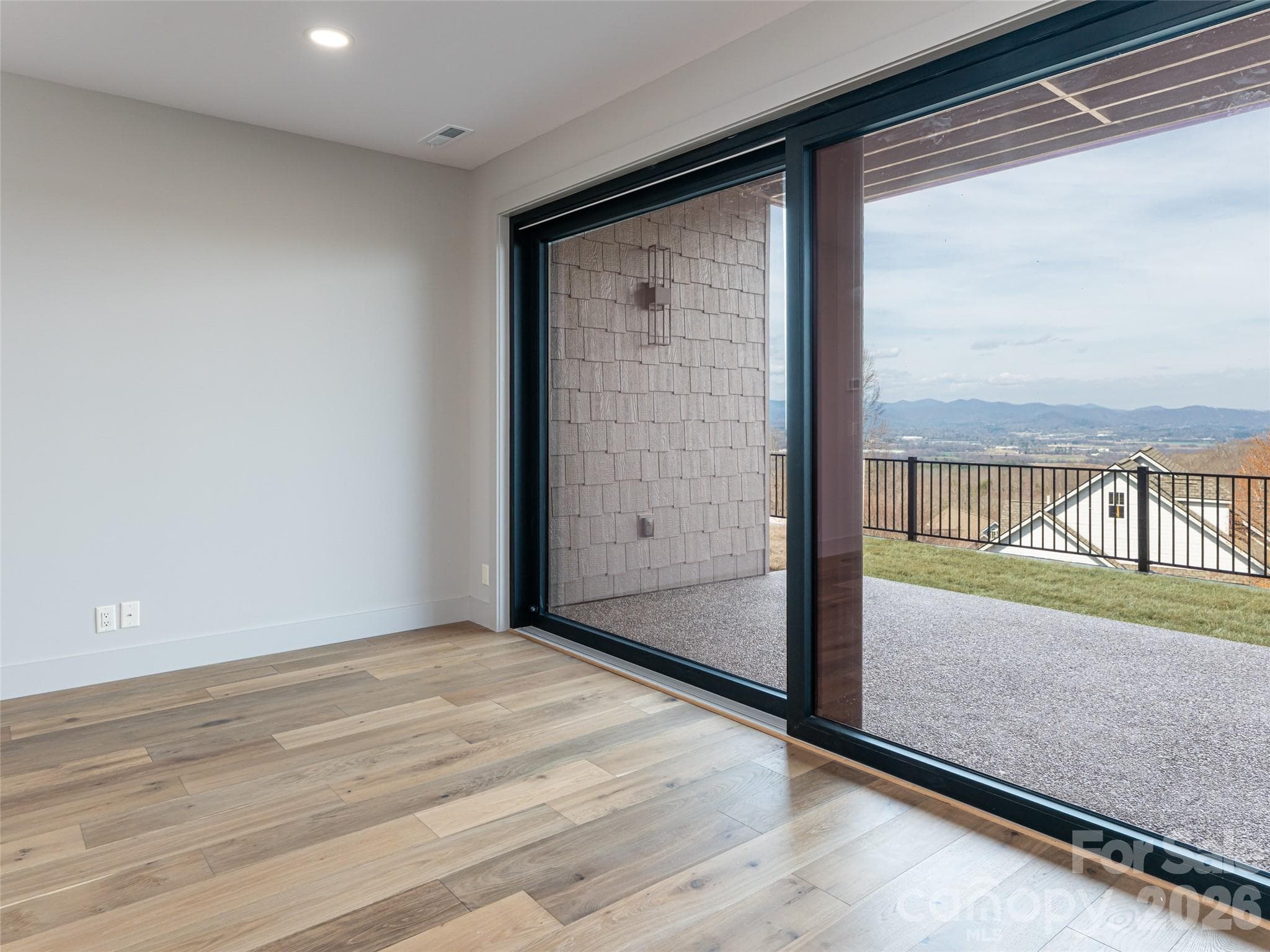 Sliding Glass doors to Terrace Patio and back yard with big mountain views - 247 Coachman Drive, Hendersonville