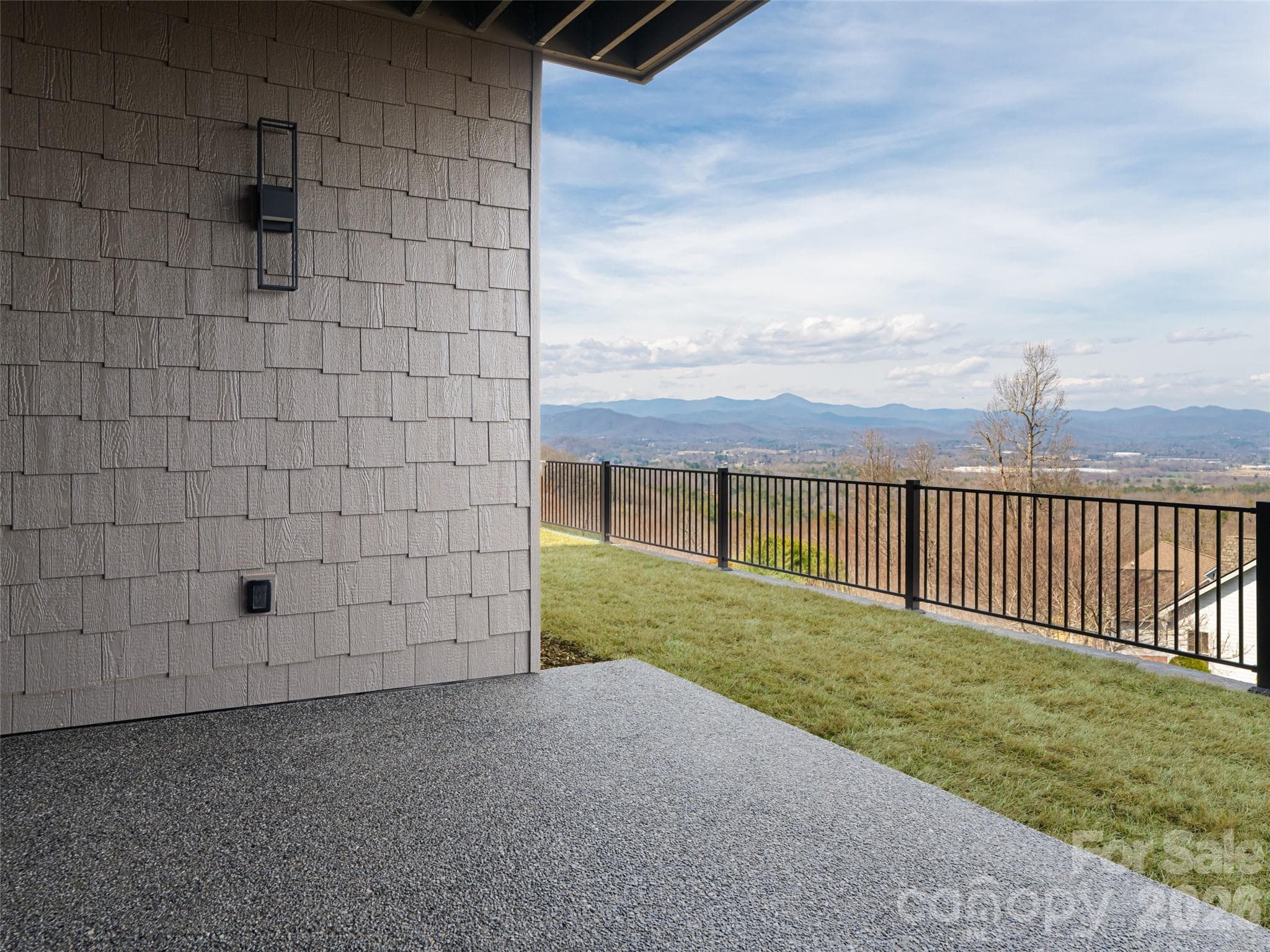 Exposed Aggregate Patio - Basement/Terrace level with fenced backyard and fantastic mountain views - 247 Coachman Drive, Hendersonville