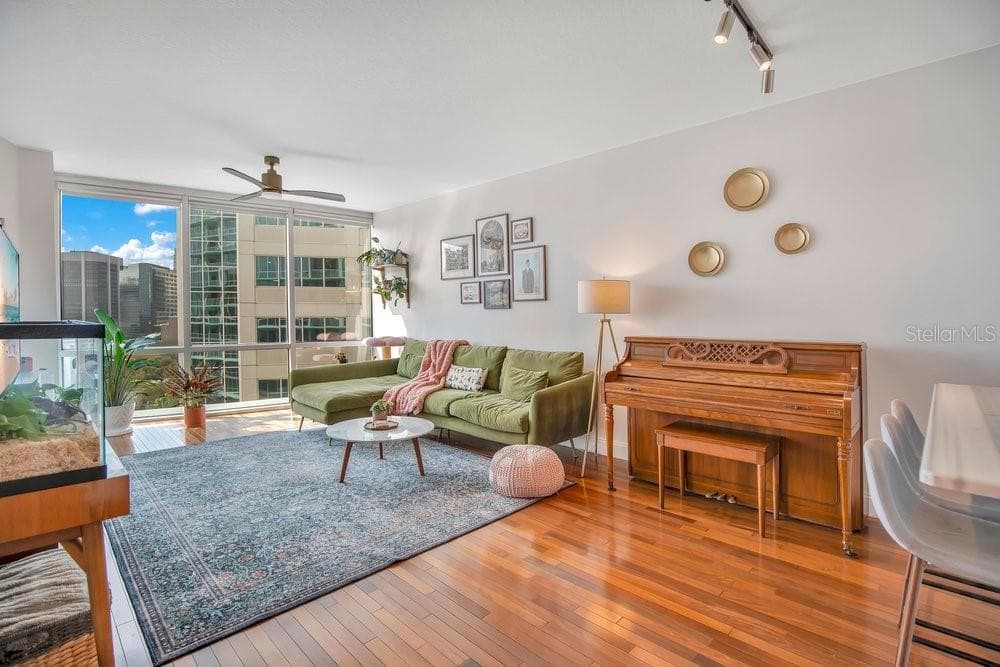Living & Dining Space, Solid Wood Flooring and Balcony Access. - 322 E CENTRAL BLVD #1005, ORLANDO