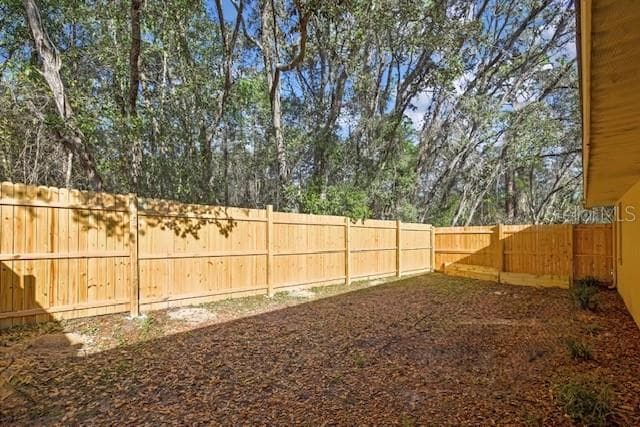 Fenced area side of home - 340 E SAVOY ST, LECANTO