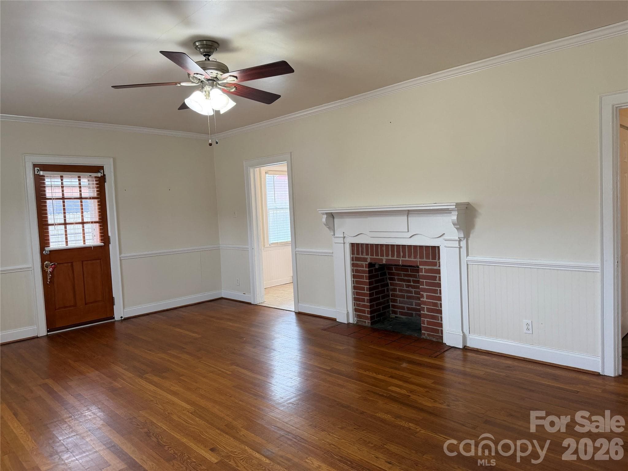 Spacious living room highlighted by a charming fireplace, creating a warm and welcoming focal point. - 612 Ballard Street, Chester