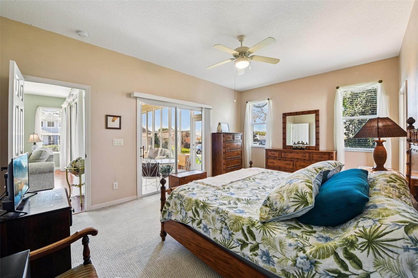 Primary Suite with relaxing view of all weather room. - 6105 DORY WAY, TAVARES