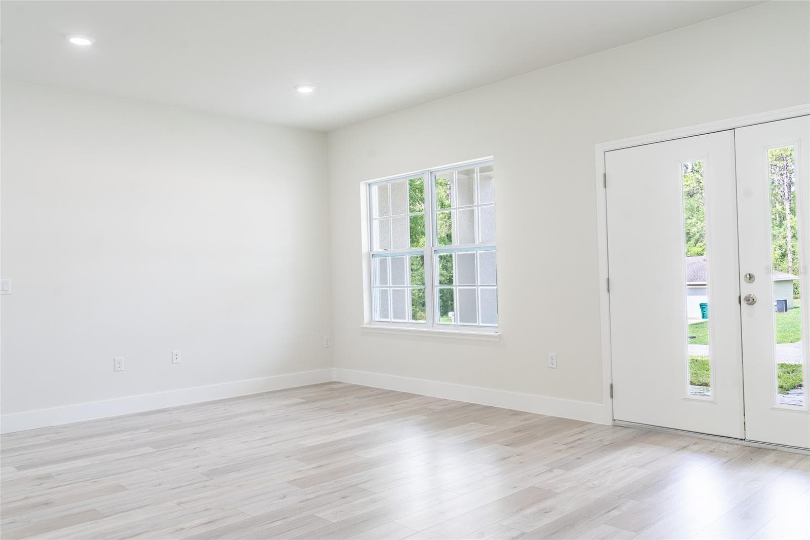 Living room with double front doors - 7872 N KEYSTONE DR, CITRUS SPRINGS