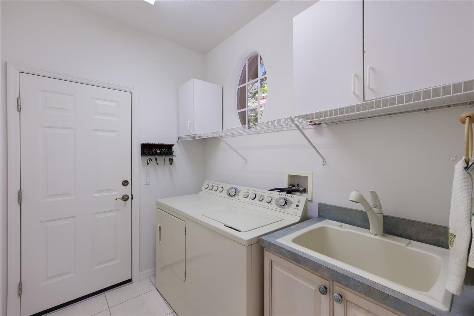 Laundry with Storage and Sink - 8428 MISTY MORNING CT, LAKEWOOD RANCH