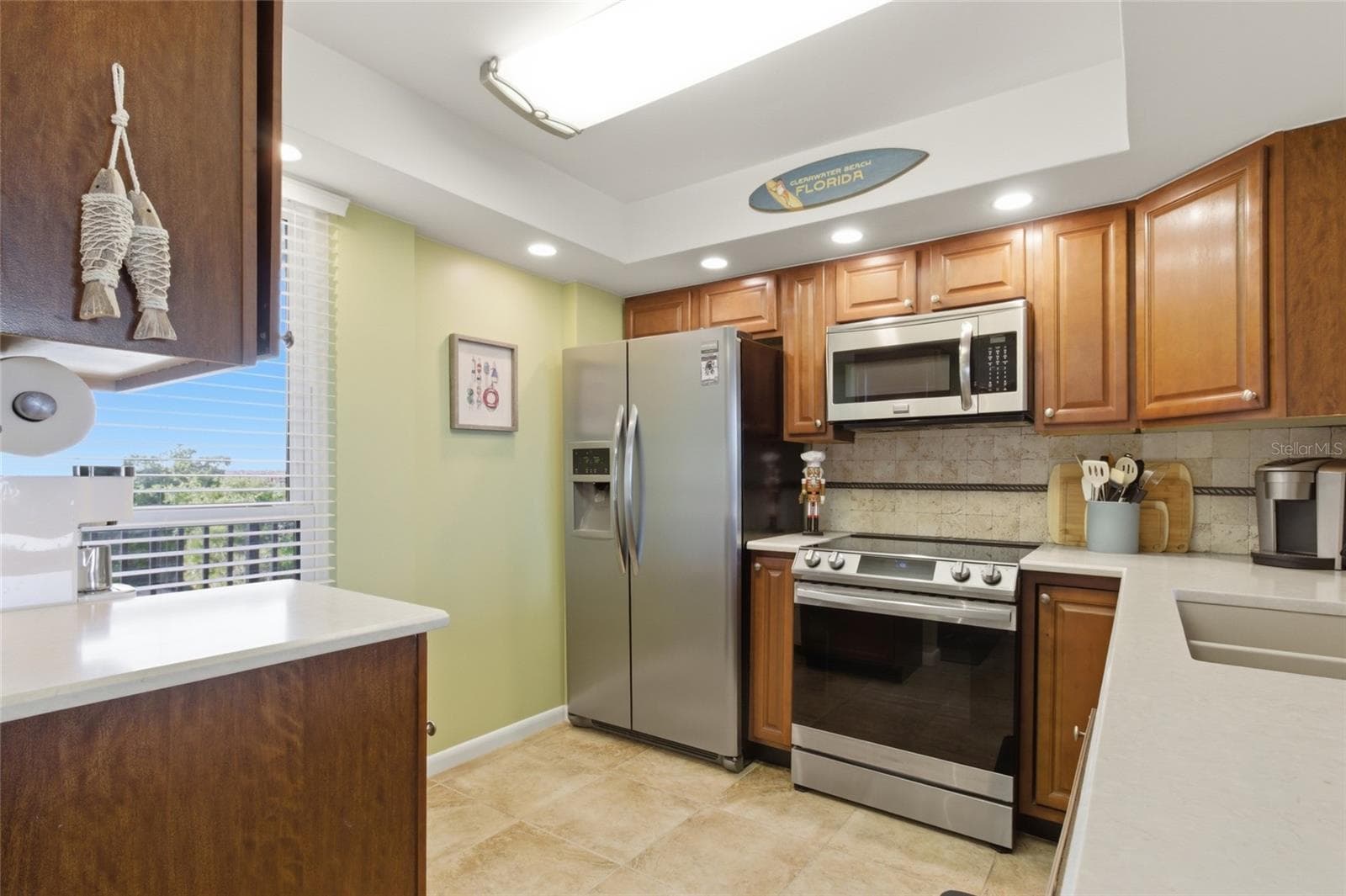 Kitchen with Stainless Appliances and Quartz Countertops...and a view! - 2616 COVE CAY DR #502, CLEARWATER