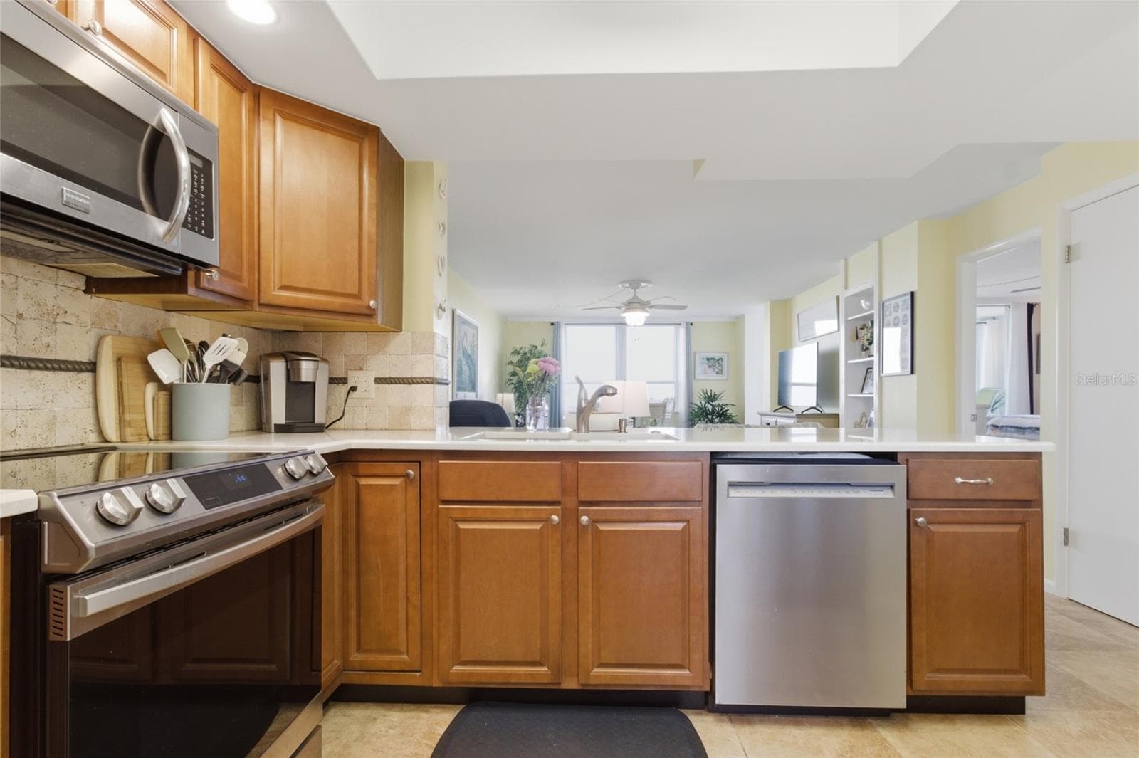 Kitchen with Stainless Appliances and Quartz Countertops - 2616 COVE CAY DR #502, CLEARWATER