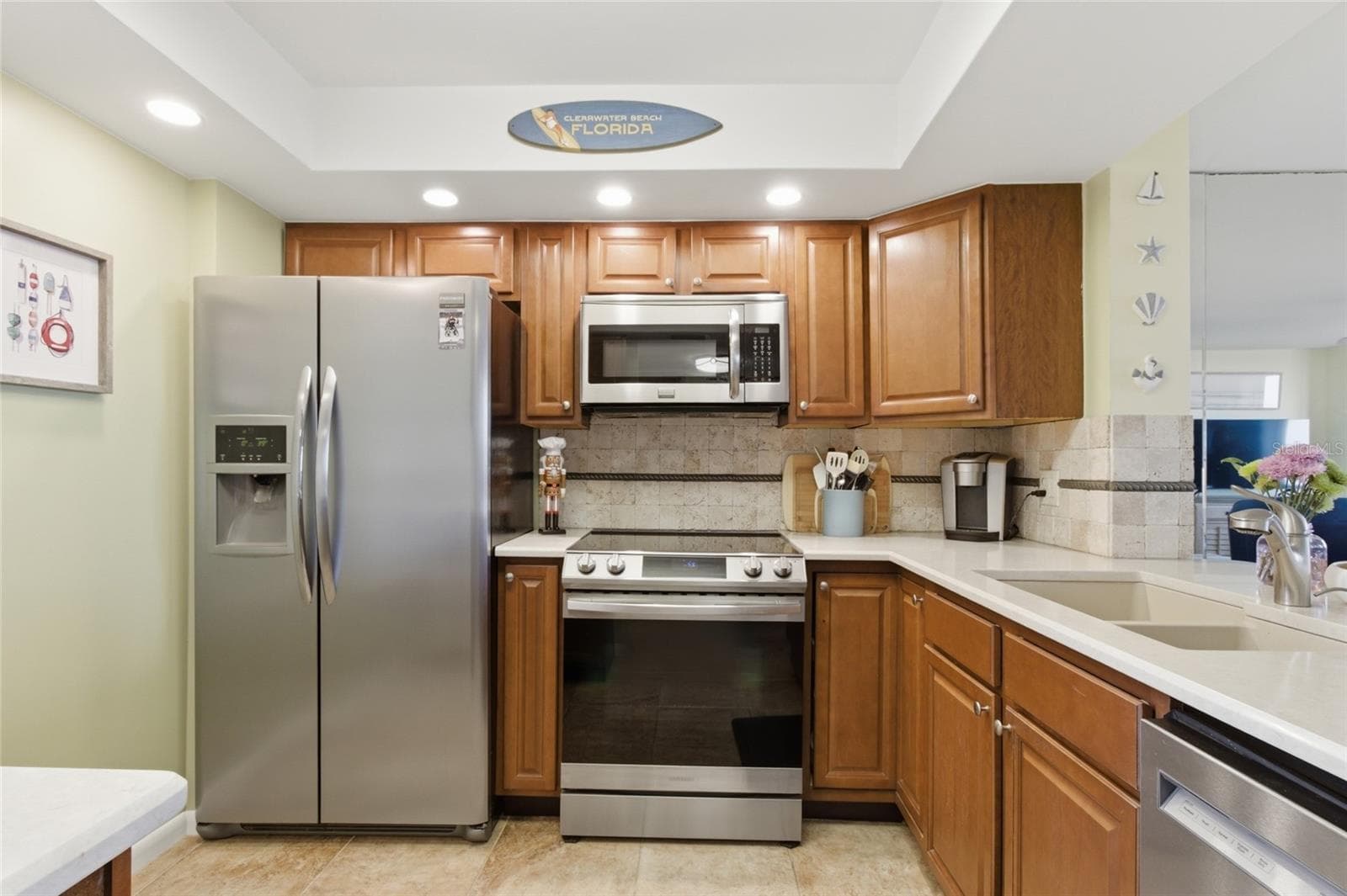 Kitchen with Stainless Appliances and Quartz Countertops - 2616 COVE CAY DR #502, CLEARWATER