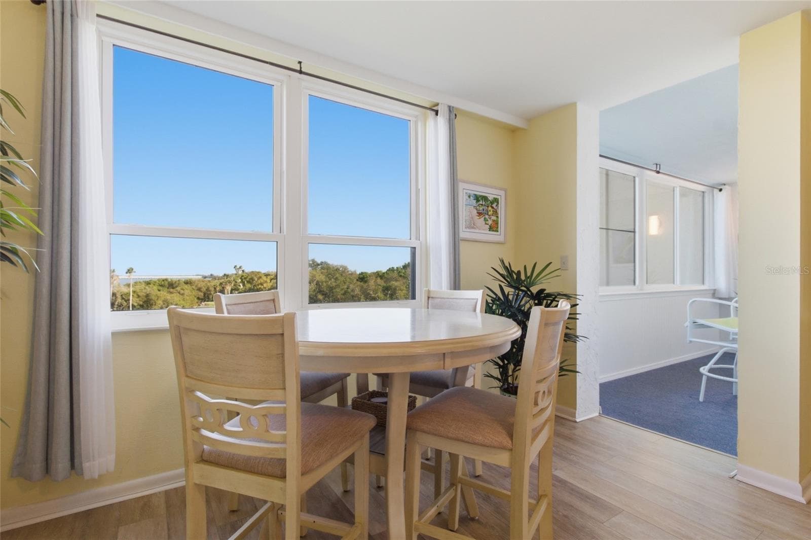 Dining Area into Enclosed Lanai - 2616 COVE CAY DR #502, CLEARWATER