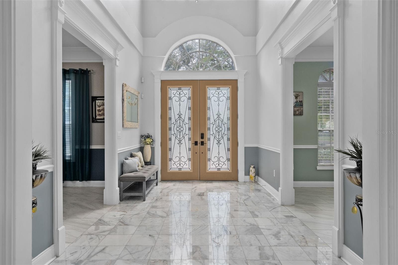Grand Foyer entrance with beautiful marble entry floor and custom doors - 9057 BALMORAL MEWS SQ, WINDERMERE