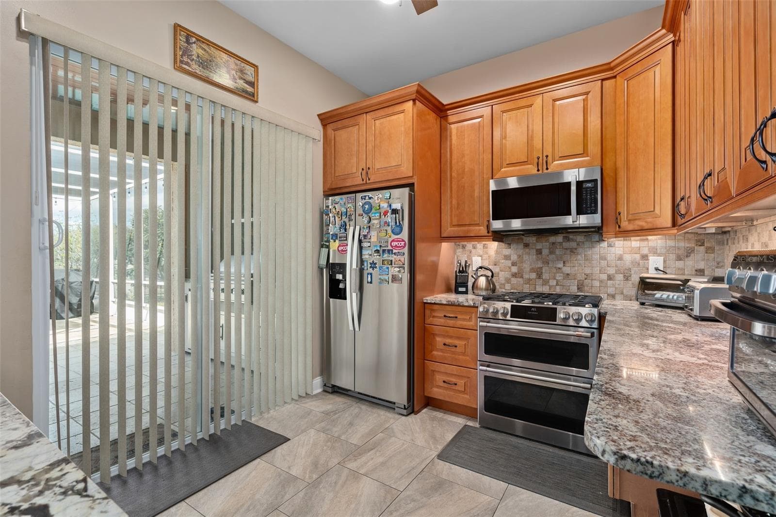 Second Kitchen has a sliding door to the rear lanai and also a door leading directly into the home. - 9057 BALMORAL MEWS SQ, WINDERMERE