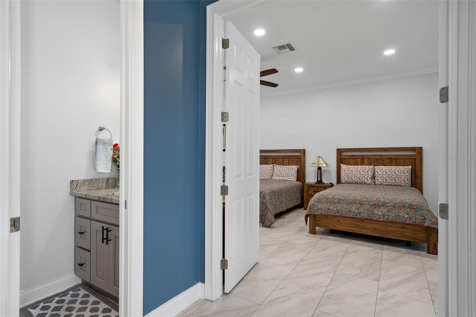 view of the downstairs master suite and downstairs half bathroom - 9057 BALMORAL MEWS SQ, WINDERMERE