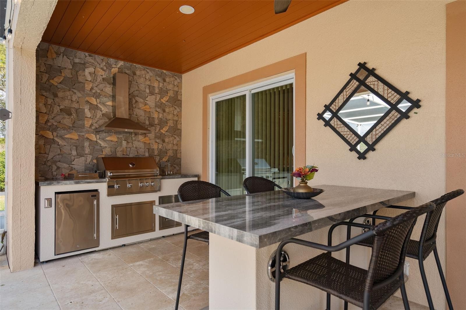 Outdoor Kitchen and outdoor seating with built in speakers - 9057 BALMORAL MEWS SQ, WINDERMERE
