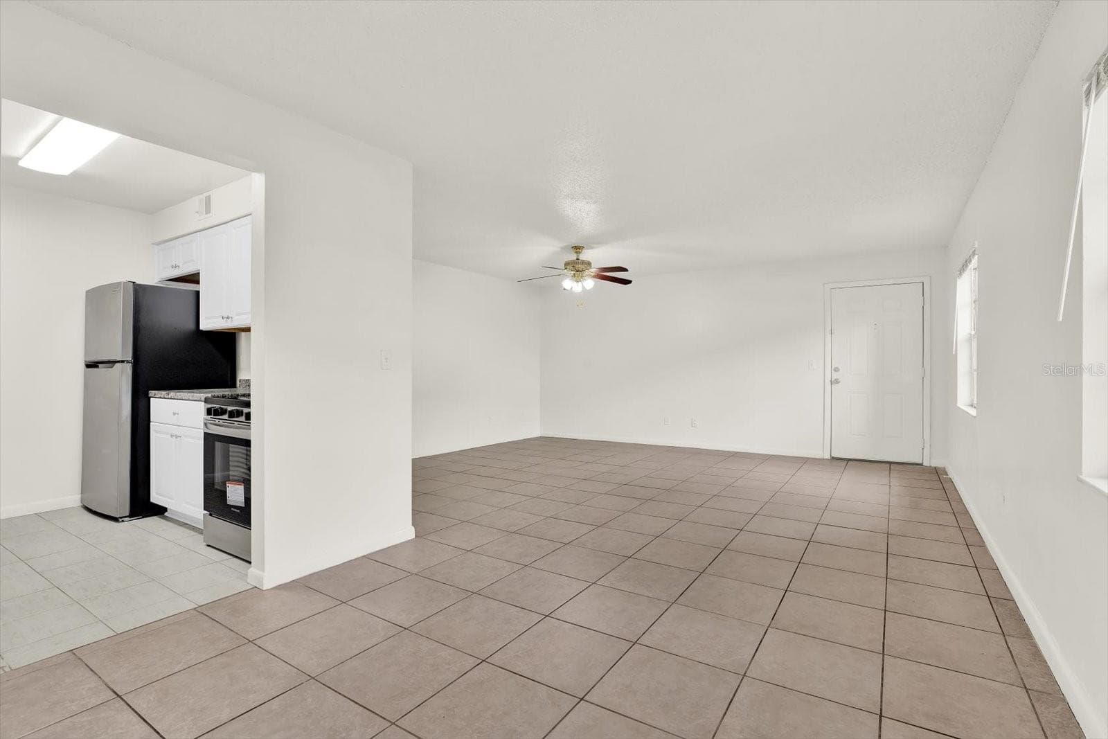 Dinning room view towards kitchen and living room - 9130 TUDOR DR #M105, TAMPA