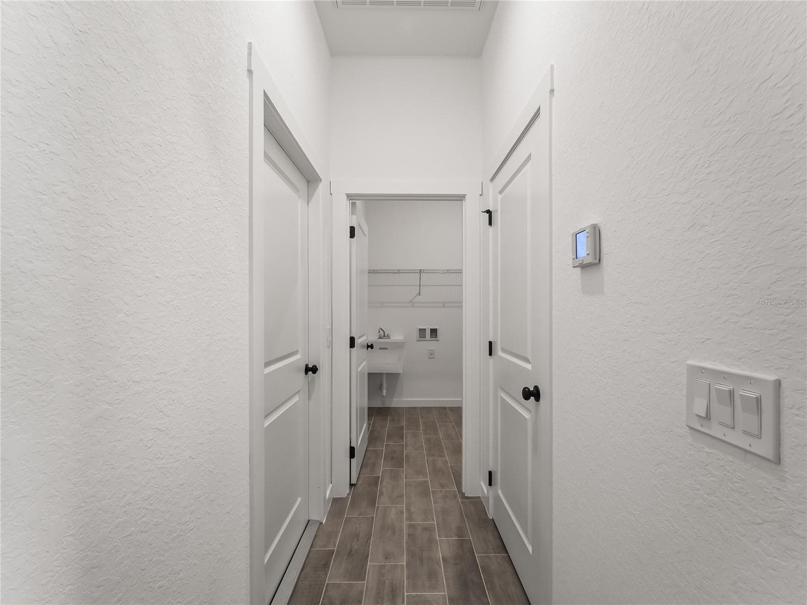 Hallway into interior laundry and garage - 4409 LACOCO ST, NORTH PORT