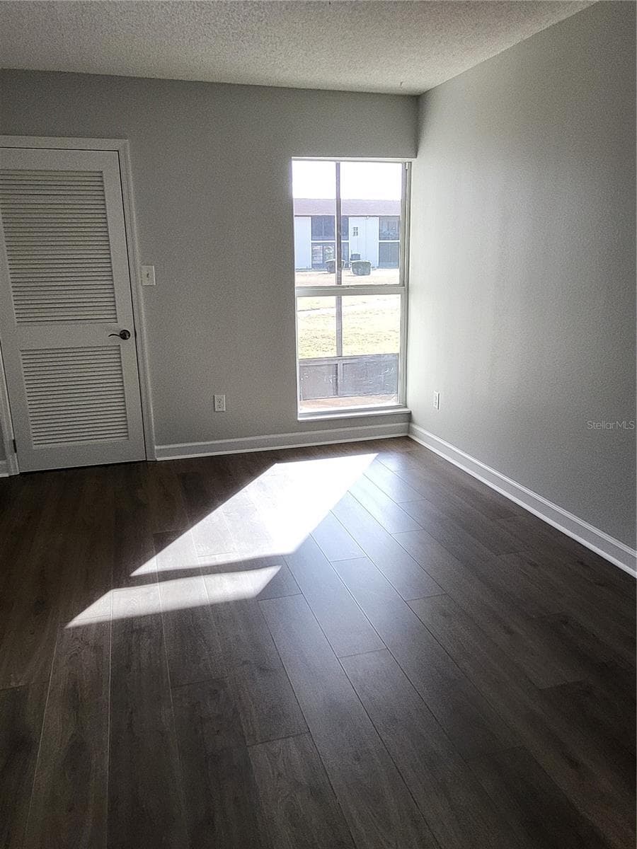Bedroom with walk in closet - 4956 HARBOR VILLA LN #103, NEW PORT RICHEY