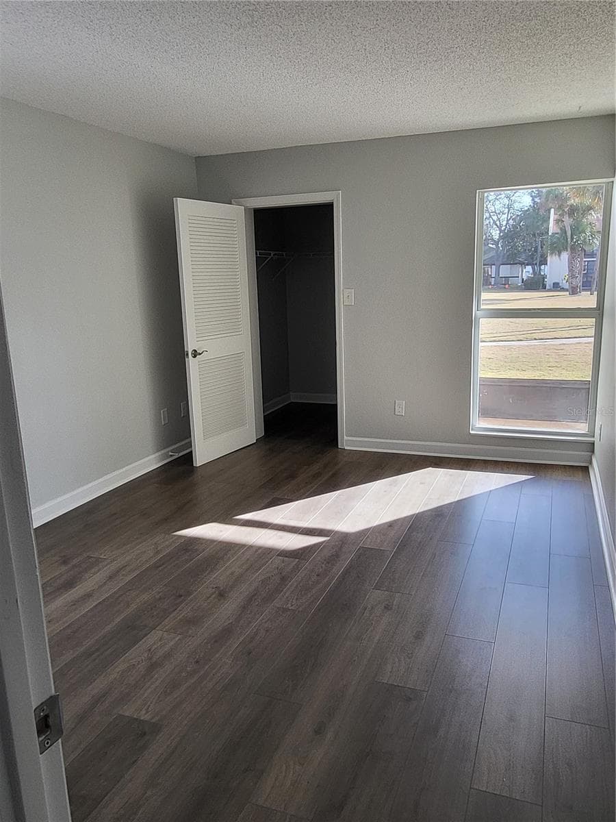 Bedroom with walk in closet - 4956 HARBOR VILLA LN #103, NEW PORT RICHEY