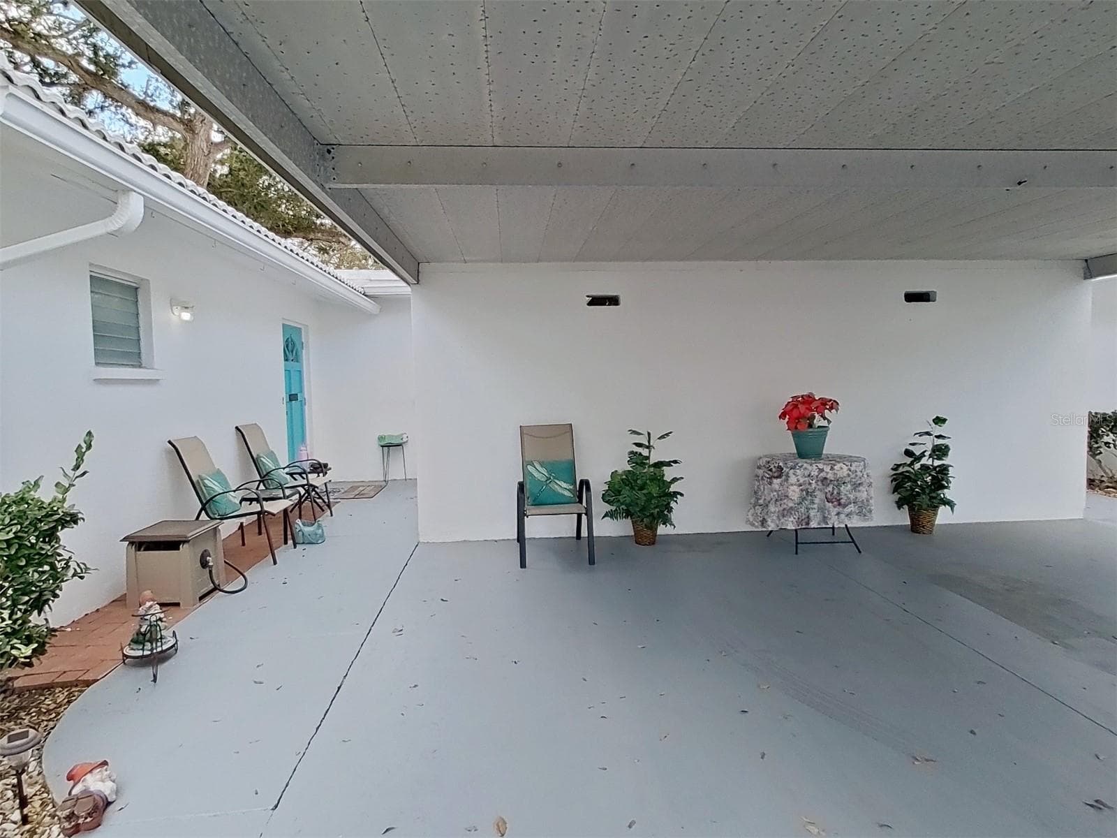 The carport will help keep your car cooler and cleaner. - 1845 VERA PL #29, SARASOTA