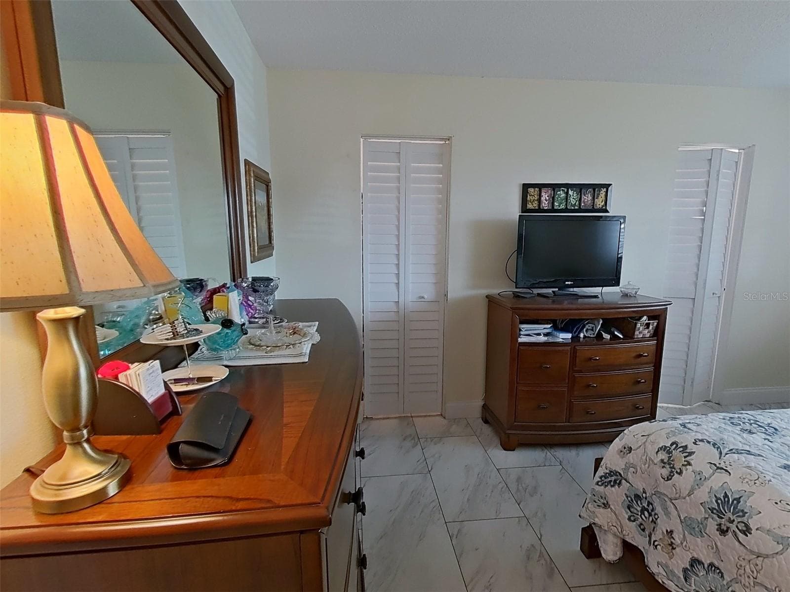 Tiled primary bedroom with walk-in closet - 1845 VERA PL #29, SARASOTA