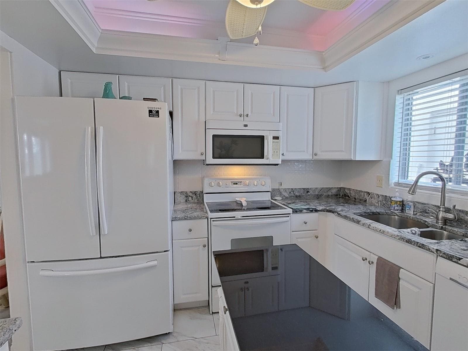 Updated kitchen with tile floors and recessed nightlights. - 1845 VERA PL #29, SARASOTA