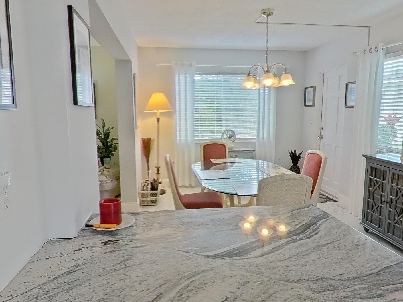 The kitchen is open to the dining room and back yard view. - 1845 VERA PL #29, SARASOTA