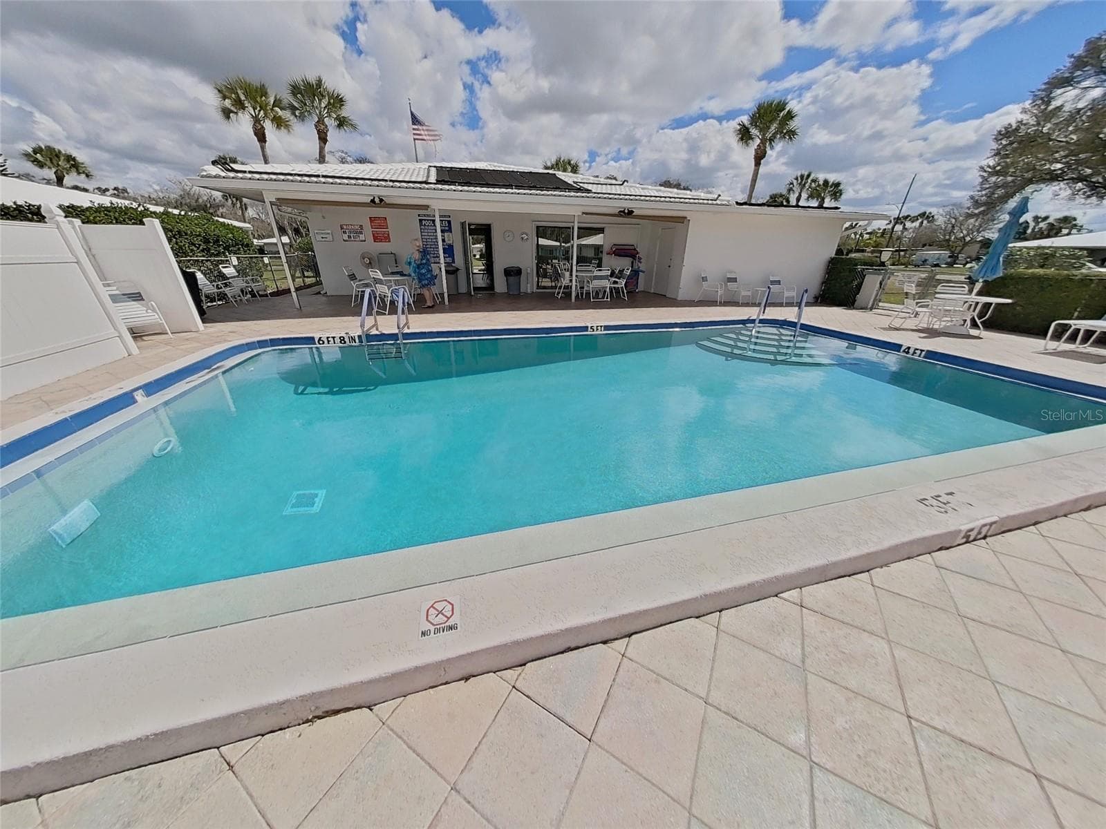 View of the clubhouse entrance from the pool and patio - 1845 VERA PL #29, SARASOTA
