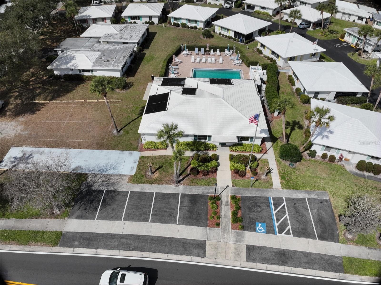 Aerial view of the clubhouse and pool area. Guest parking and shuffleboard. - 1845 VERA PL #29, SARASOTA