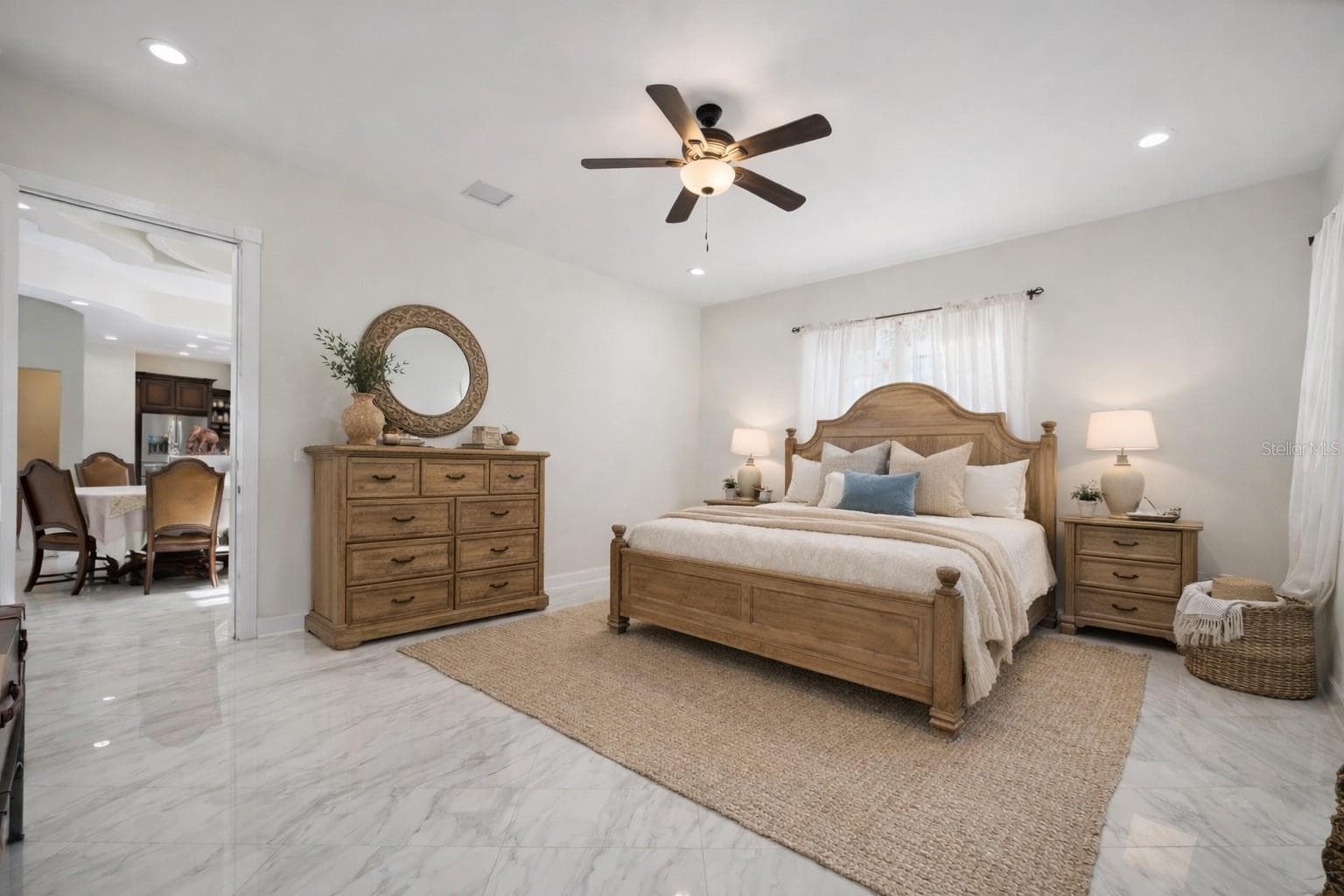Primary bedroom, bottom floor, with ensuite and walk in closet - Virtual staging added to demonstrate possible furniture placement. - 775 CHRISTINA LAKE DR, LAKELAND
