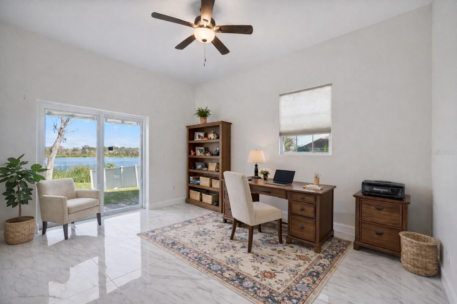 office/bedroom downstairs, includes closet and slider to back yard. Virtual staging added to demonstrate possible furniture placement. - 775 CHRISTINA LAKE DR, LAKELAND