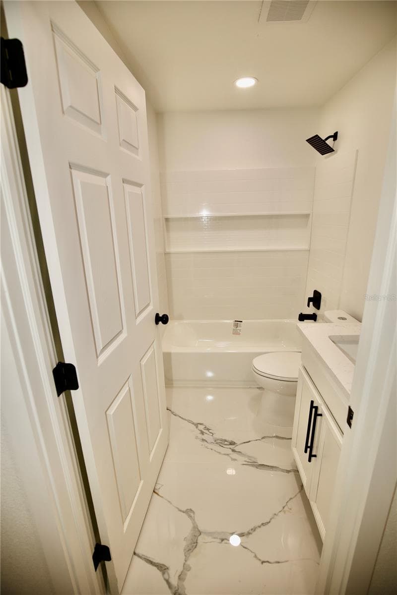 Second Bath. Porcelain floors with Quartz counters. - 2235 WAUTOMA PL, ORLANDO